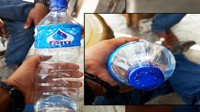 लिपको पेटीमा सिल लगाएको खाली बोत्तल